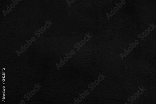 Dark wall background. Black rough plaster texture