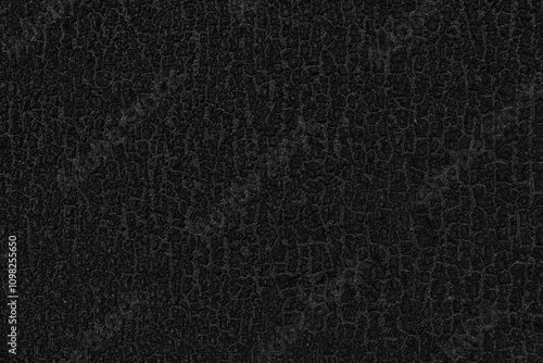Black, dark coarse grainy background. Black grainy texture