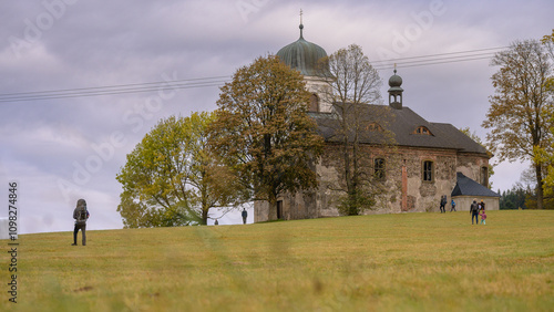 St. Matthew's Church in the Eagle Mountains in the Czech Republic, autumn weather, people running around and enjoying autumn.