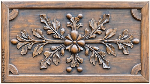 Ornate wooden carving with floral design on a textured background. photo