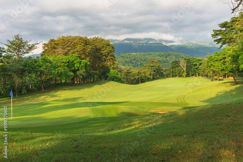 Panorama View of Golf Course with putting green in Taman Dayu Pandaan, Pasuruan, East Java, Indonesia. Golf course with a rich green turf beautiful scenery. photo