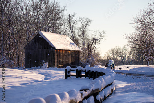 country road with snowy background on winter morning