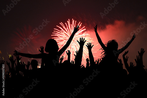 Happy people partying at New Year's or a concert