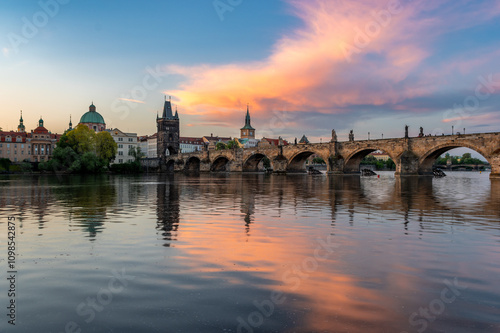 Colorful sunrise over Charles Bridge (Karluv Most) over Vltava River in Prague, Czech Republic