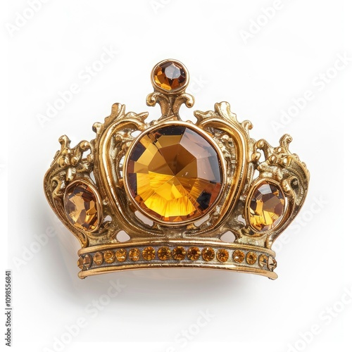 Golden crown brooch with one crystal isolated on white background photo