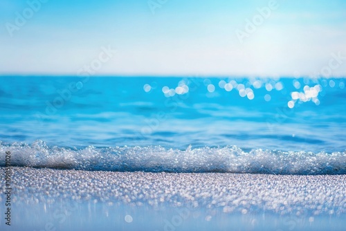 Beach scene with wave approaching the shore, suitable for travel or weather related images photo