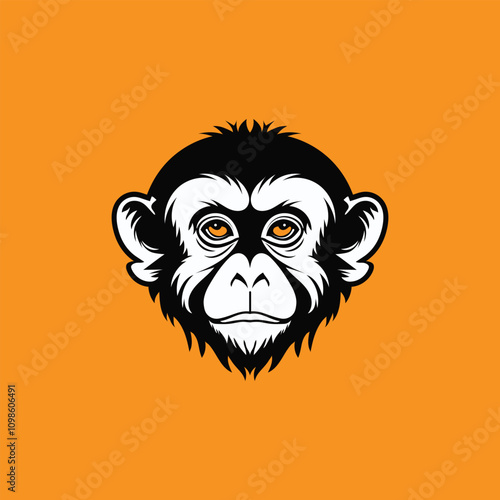 a monkey face logo with yellow eyes and a black and orange background
