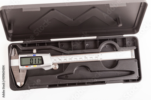 caliper. a device for measuring precision. the size of a part, as well as the diameter. close-up.