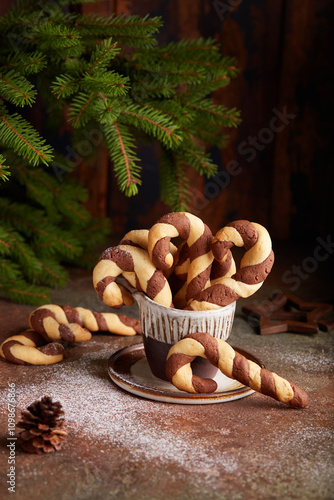 Christmas cookies in a shape of candy cane with chocolate and vanilla flavor. Delicious homemade dessert