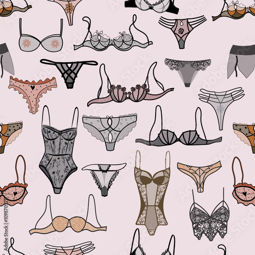 Stylish seamless pattern with lingerie sets: lace bras, panties, thongs and negligee with floral embroidery. Elegant and romantic design for textiles or fashion projects.