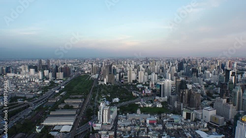 Wallpaper Mural BANGKOK, THAILAND - AUGUST 2024 : Aerial high angle view of Bangkok city in sunset. View of buildings and streets around downtown Siam area. Torontodigital.ca