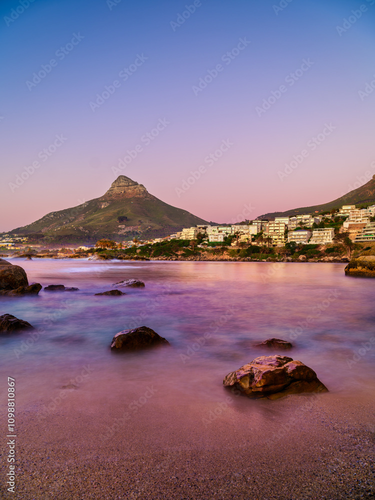 Twilight colors at sunset in Camps Bay, vertical shot, Cape Town, South Africa