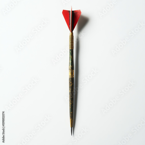 Dart with red feathered tip, white isolated background photo