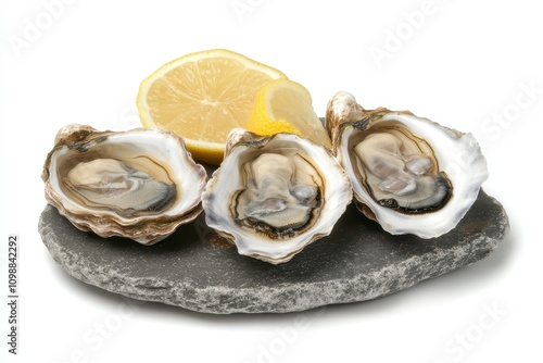 Serve Fines de Claire oysters on a stone slab with lemon photo