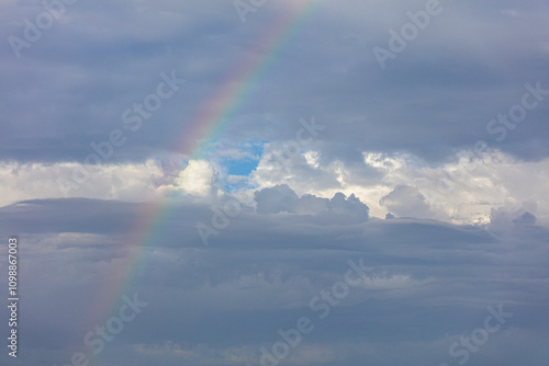 rainbow over dark clouds