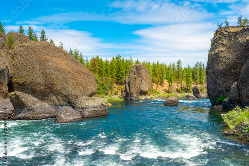 Large boulders and river rapids long the Spokane River at the Bowl and Pitcher area of Riverside State Park in Spokane Washington, USA	 photo