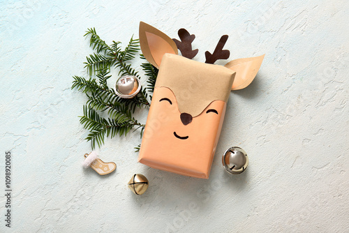 Beautiful composition with present box and Christmas balls on blue grunge bac...