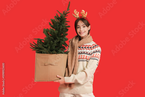 Young woman with reindeer h...