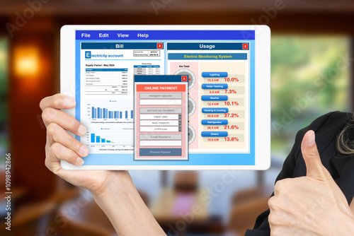 Valokuva Computer application showing electricity bill and usage with online payment window on digital tablet screen