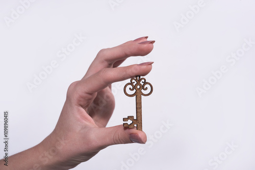 House rent. House key. Real estate concept. Woman holding house key. Mortgage. House key in hands. Copy space or blank space for text. Realtor.