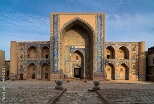 Monument of the heyday of Central Asian architecture in the historical center of Bukhara, Ulugbek Madrasah on a sunny day, Bukhara, Uzbekistan