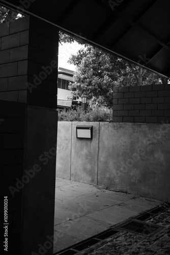 The corner of a semi-outdoor place made of cement and red brick walls is quiet photo