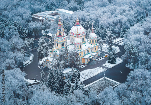 snow covered trees and church