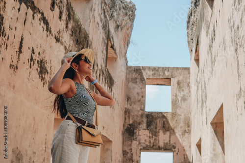 Beautiful Asian woman standing inside Tamansari building, Yogyakarta. photo