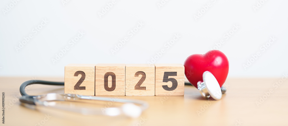 Fototapeta premium Happy New Year 2025 with Stethoscope of doctor and heart shape on table. health care, Insurance, Wellness and medical concept