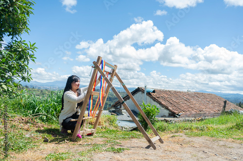 Latin woman doing crafts with wool outdoors photo