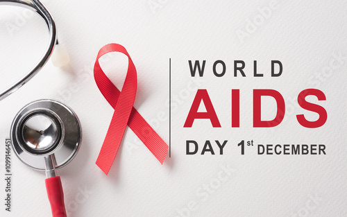 Closeup red ribbon HIV, world AIDS day awareness ribbon on white background. Healthcare and medicine concept.