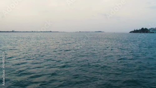 Bahia de San largest body of water seen from moving boat, Puerto Rico, dusk photo