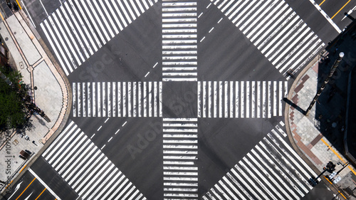 Top view of the iconic Ginza street in Japan, showcasing detailed road texture and crosswalk patterns. A symbolic urban scene of Tokyo's famous shopping district.