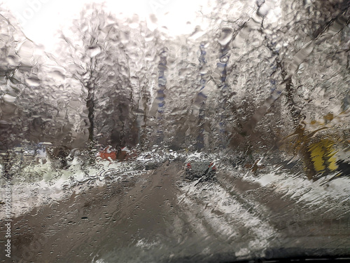 the view through the rain-soaked car window
