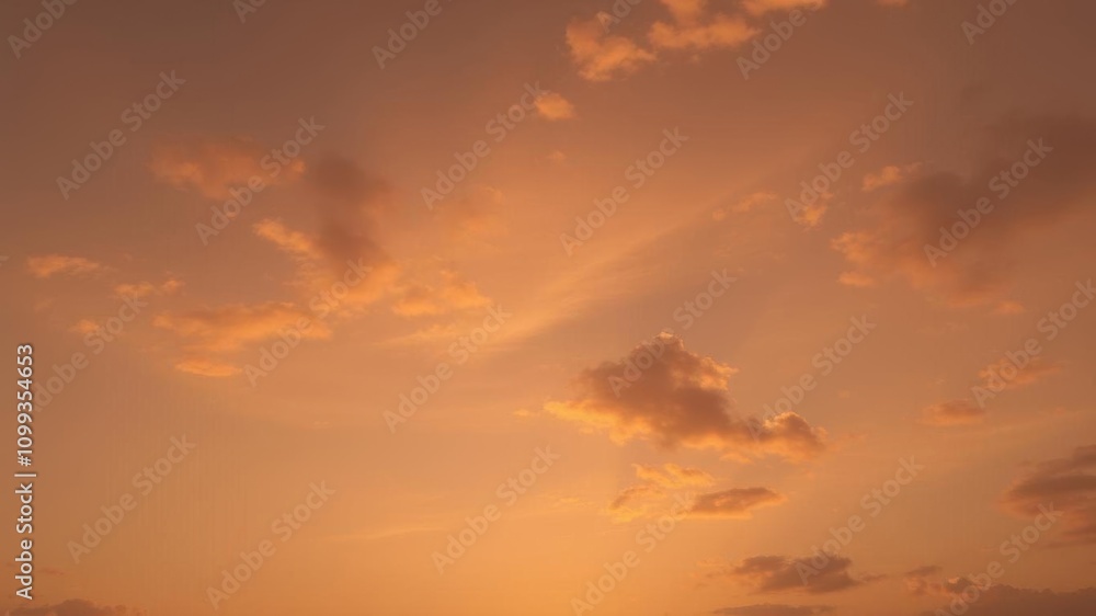 Obraz premium Sunset sky with fluffy golden clouds, atmosphere, sunset