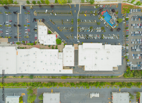 A parking lot with a large building in the background