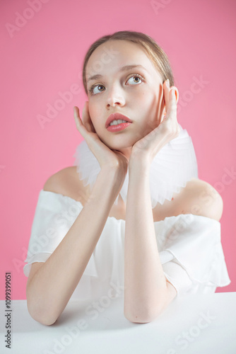 Beautiful girl in a white dress with a jabot around her neck