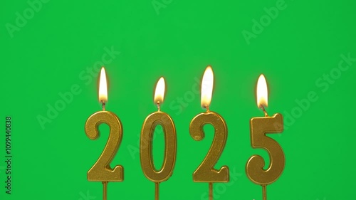 Happy New Year 2025, seamless looping of golden candle number 2025 for new year celebrate party was lit. flame at candlewick sway isolated on green screen background, horizontal frame rate 60P photo