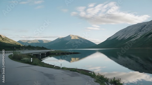 Lake with mountains in the background and a foreground dock