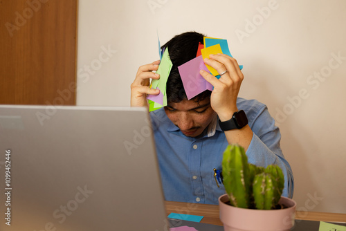Man with a lot of work in his office desperate, concept of stress at work