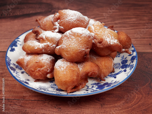 Traditional doughnuts poured with the spoon