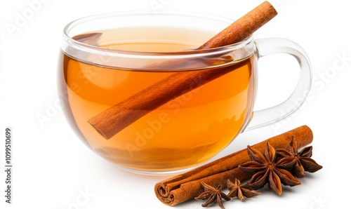 Steaming wassail in a clear glass mug with a cinnamon stick and star anise isolated on a white background  photo