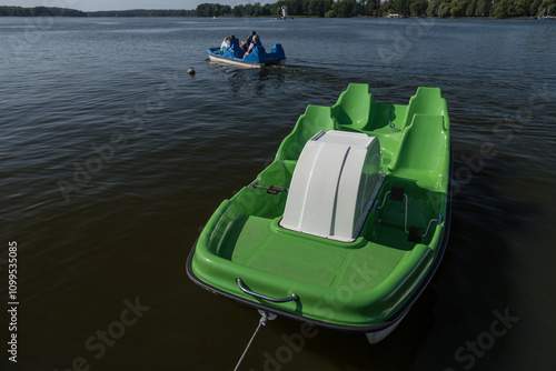 WATER RECREATION - Green-White pedalo on the lake
