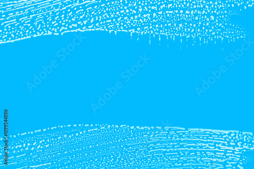 soap foam wipe marks on window glass, blue background