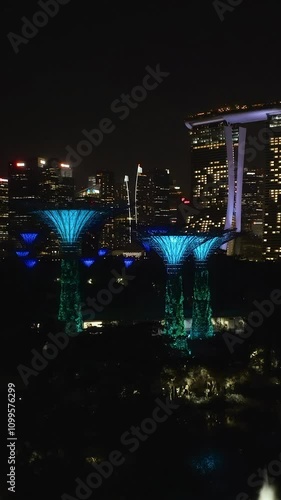Wallpaper Mural Night lights in Gardens by The Bay | Marina Bay Sands 5-star hotel in Singapore, vertical video. Torontodigital.ca