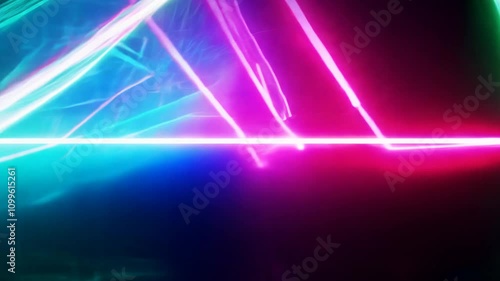 Vibrant neon pink, green, and blue light bars blur as the camera fast pans across them, creating a sense of energy and rhythm