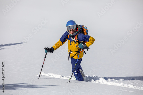 Skiing adventure in fresh powder snow with mountain gear photo