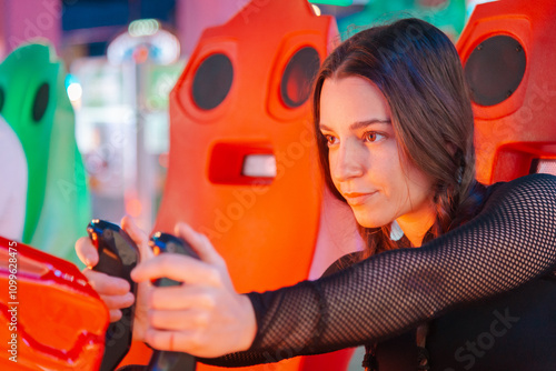 Immersive gaming experience with girl at arcade machine photo