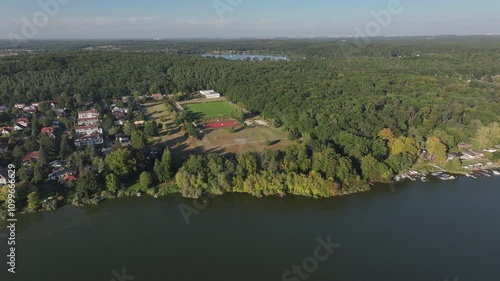 Aerial view of serene Weisser See surrounded by lush greenery and tranquil waters, Nedlitz, Brandenburg, Germany. photo