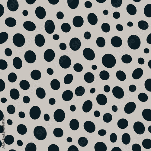 Abstract vector seamless pattern with black circles. Simple geometric round shapes repeated design on gray background. Modern polka dot ornament for fashion, home decor, wrapping paper, textile